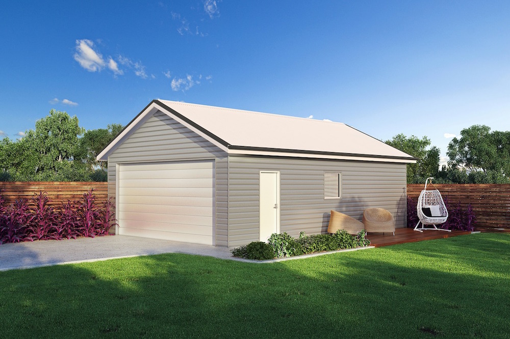 A light gray prefabricated steel garage with a white roof purchased from Titan Steel Structures by a hard working family man